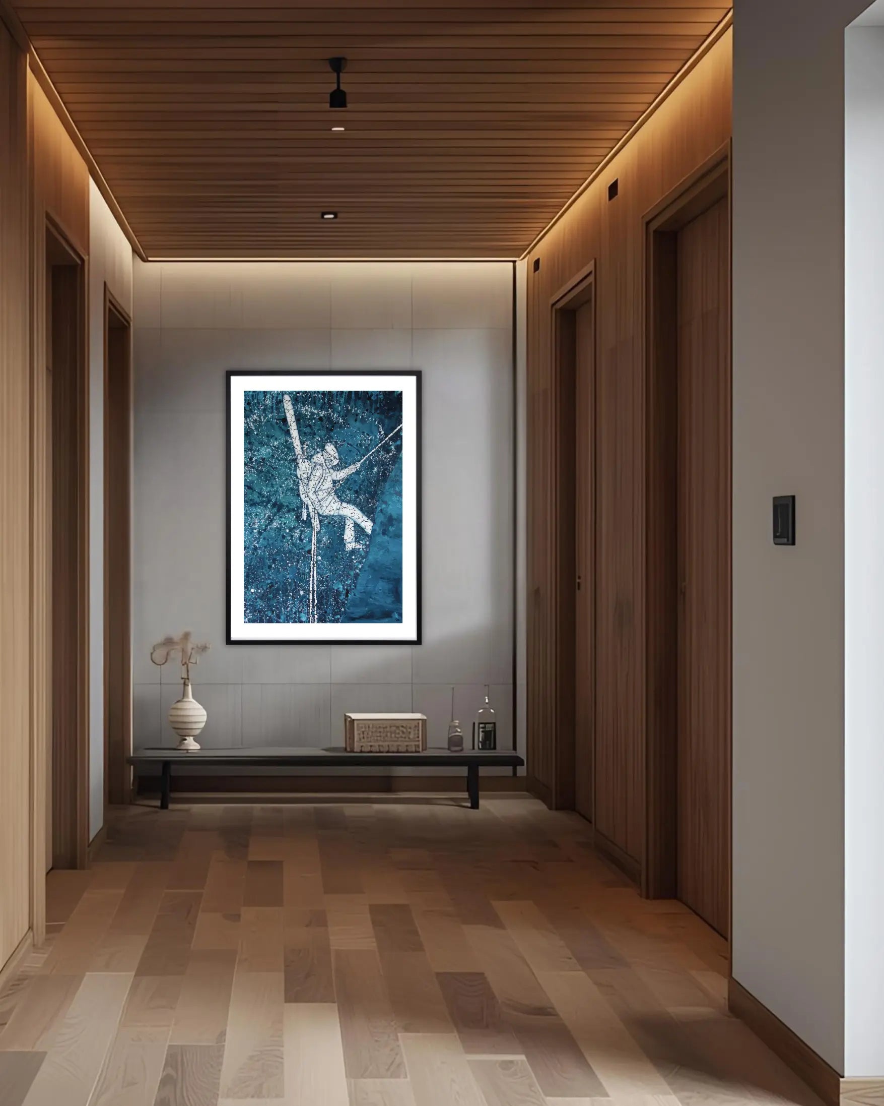 Modern hallway with a framed ski art painting on a gray wall.