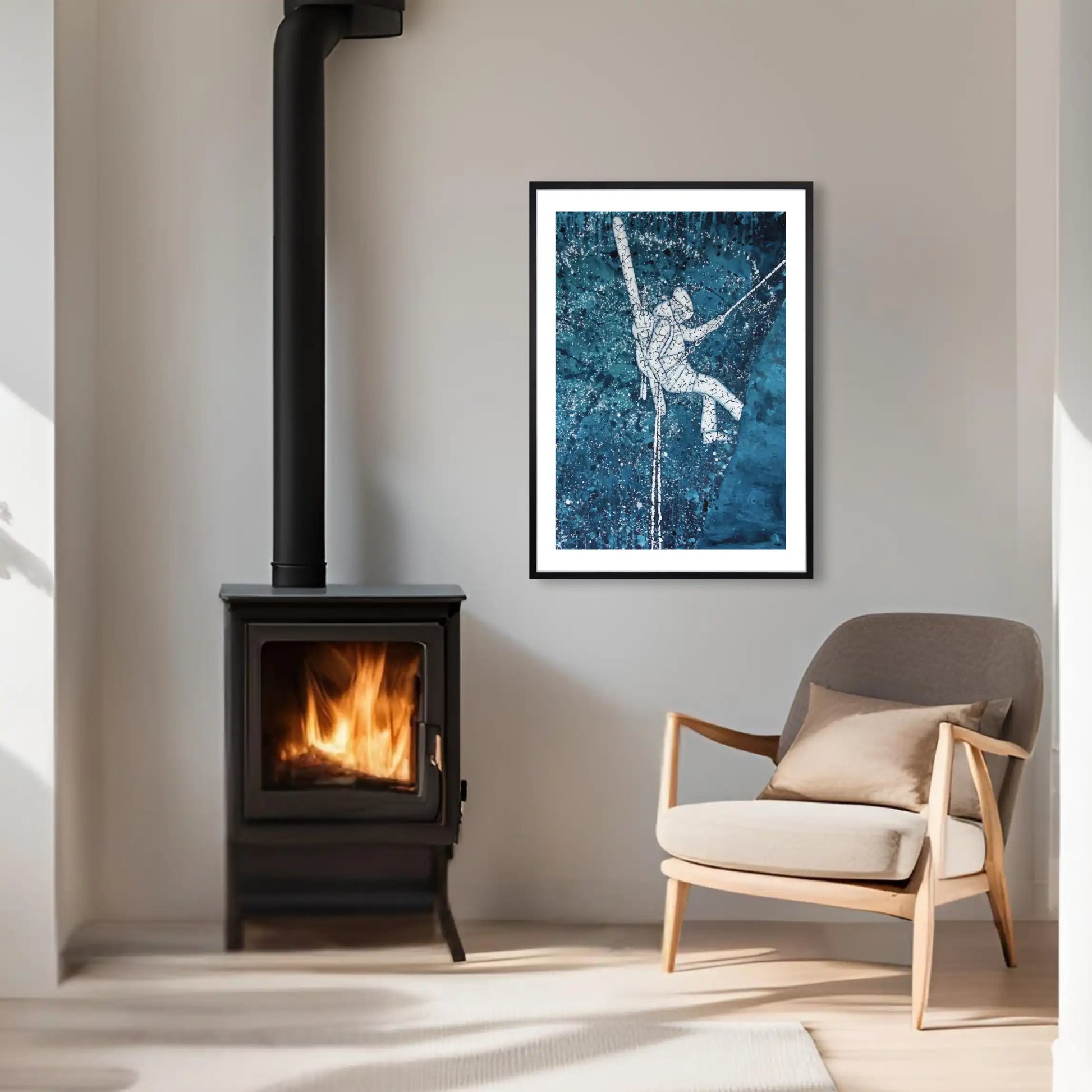 Living room with a wood stove and framed ski artwork on the wall