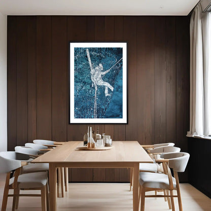 Dining room with wooden table and chairs, framed ski artwork on the wall.