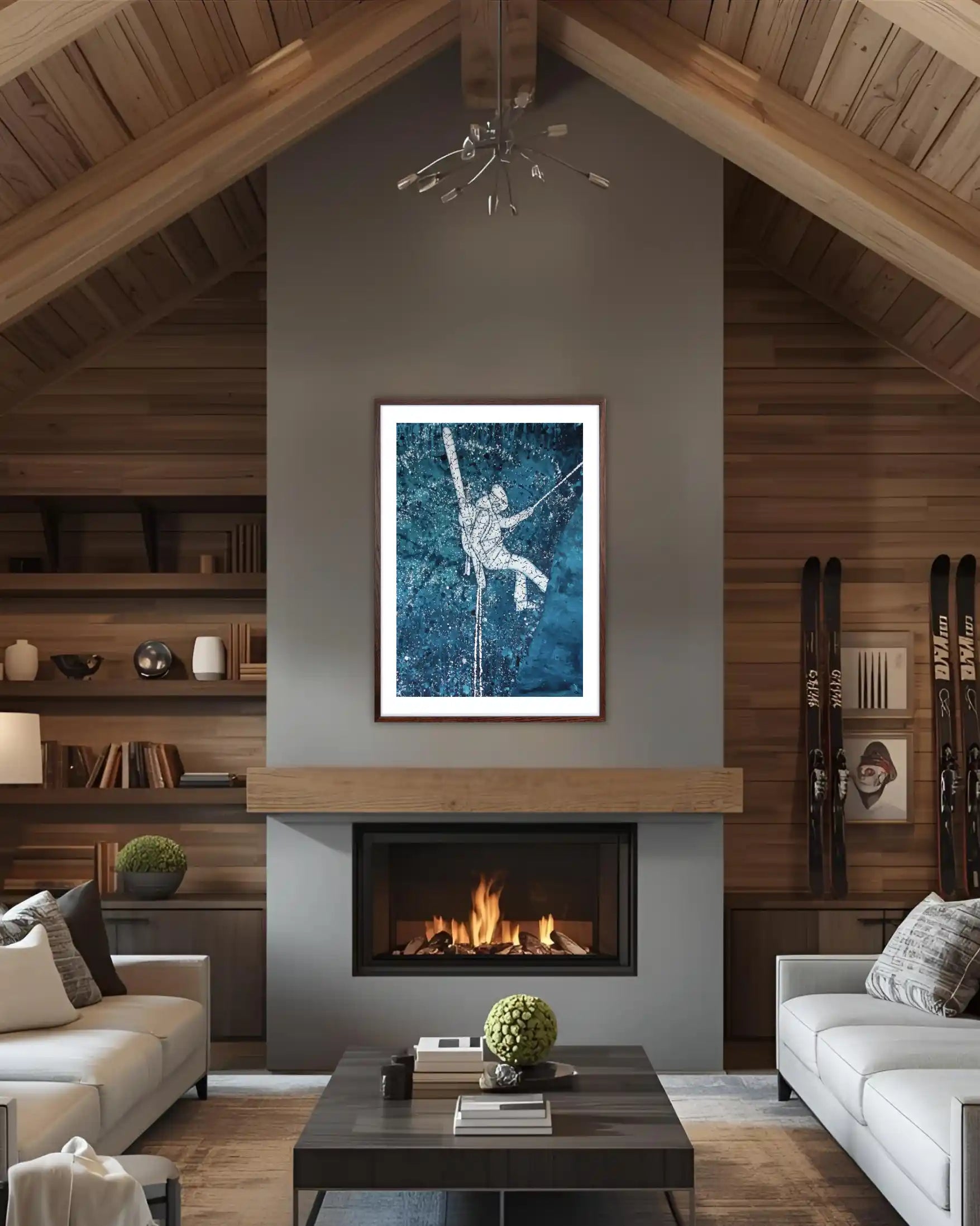 Modern living room with a fireplace, bookshelves, and a framedski  artwork on the wall.